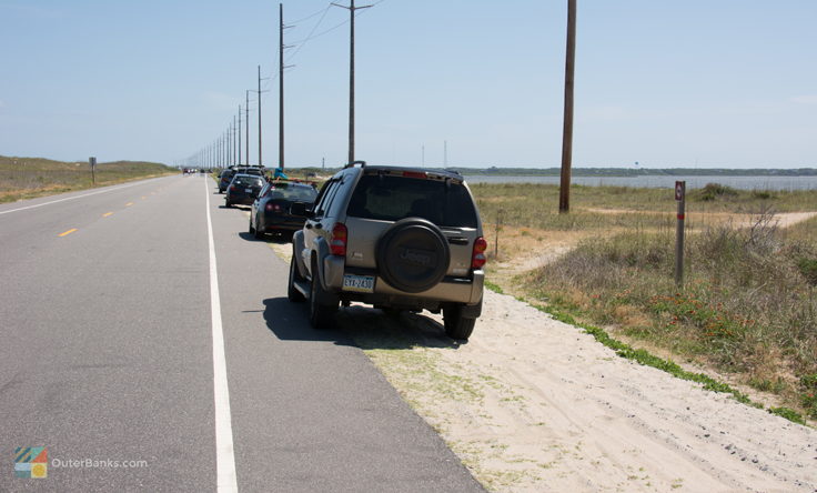 Cars line NC-12 at Canadian Hole, South of Haulover