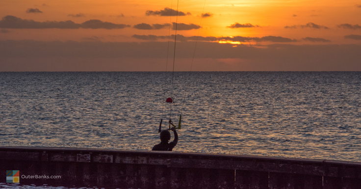 Kiteboarder watching the sunset over Pamlico Sound