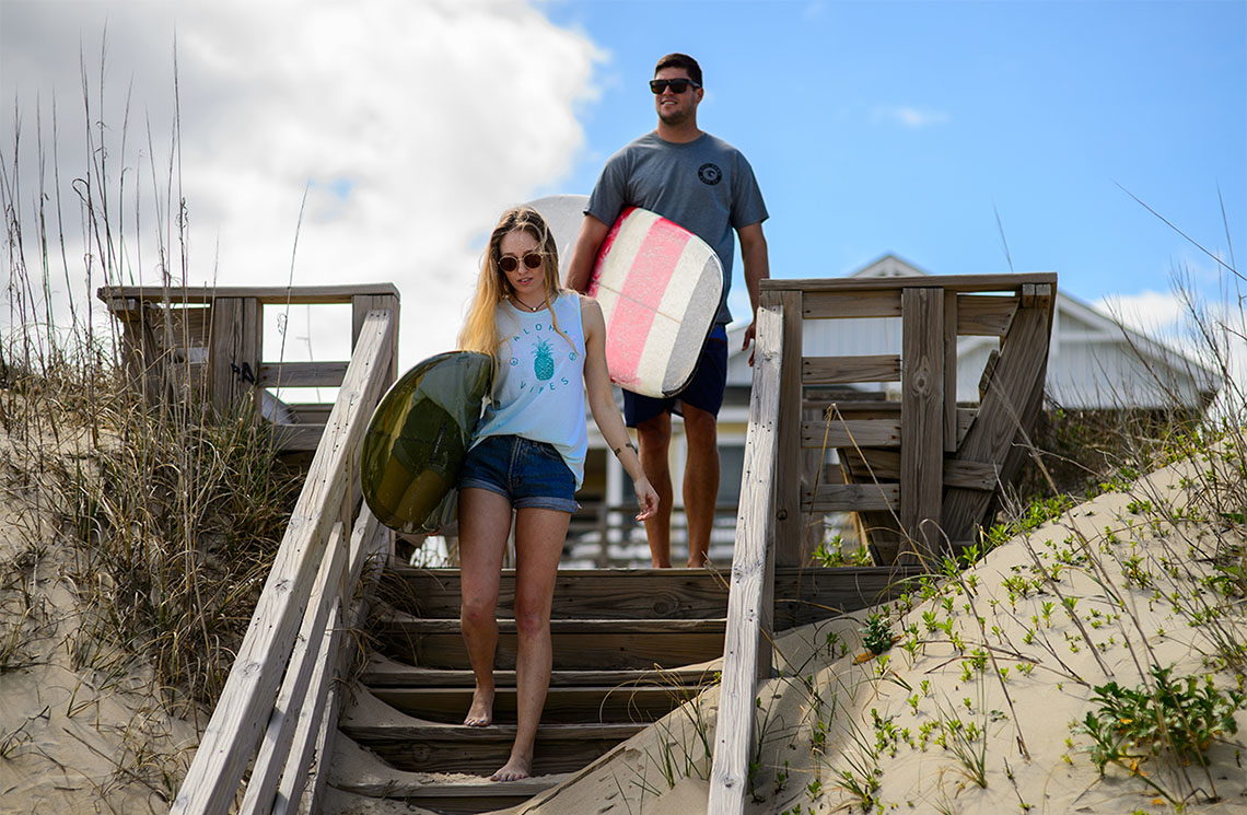 Kitty Hawk Surf Co. - taking surfboards to the beach